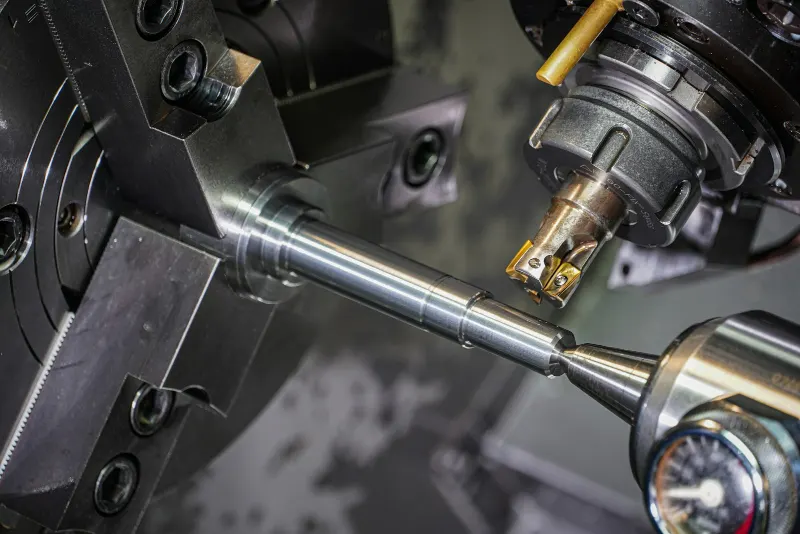 Close-up of a shaft being machined - the kind of part a vision station inspects