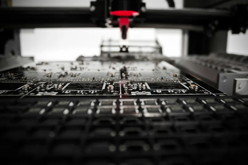Precision automated machine working on an electronics board